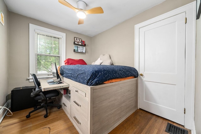 1397 Glenn Ave, Columbus, OH 43212 - bedroom with wood finished floors, a desk, and ceiling fan