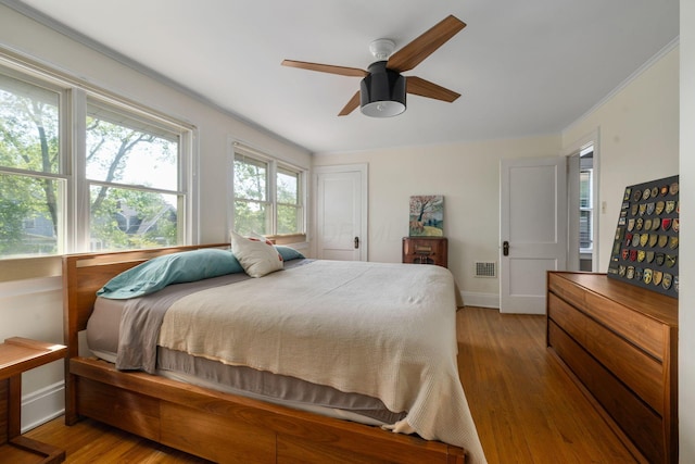 1397 Glenn Ave, Columbus, OH 43212 - bedroom featuring wood finished floors, baseboards, ornamental molding, and a ceiling fan