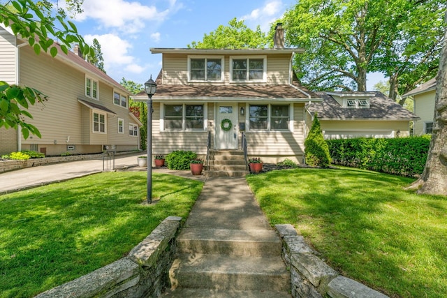 1397 Glenn Ave, Columbus, OH 43212 - view of front of property with entry steps, a front lawn, and a chimney