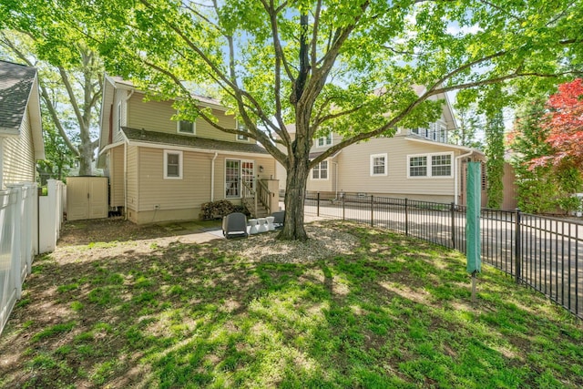 1397 Glenn Ave, Columbus, OH 43212 - back of house with a fenced backyard, an outdoor structure, and a storage shed