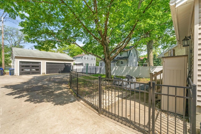1397 Glenn Ave, Columbus, OH 43212 - view of front facade with a detached garage, an outbuilding, fence, and a residential view