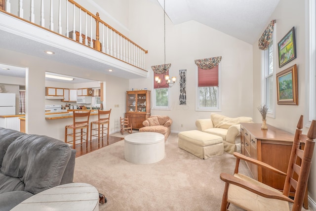 6181 Perry Rd, Centerburg, OH 43011 - living room with high vaulted ceiling, baseboards, a notable chandelier, and carpet flooring