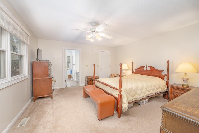 6181 Perry Rd, Centerburg, OH 43011 - bedroom with ceiling fan, light carpet, baseboards, ensuite bath, and visible vents