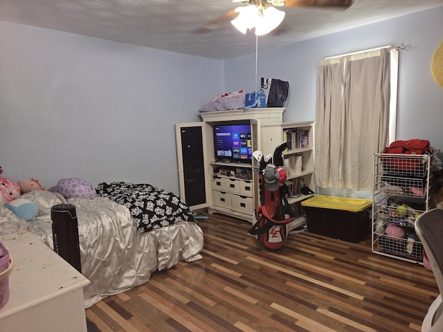 bedroom with a ceiling fan and wood finished floors