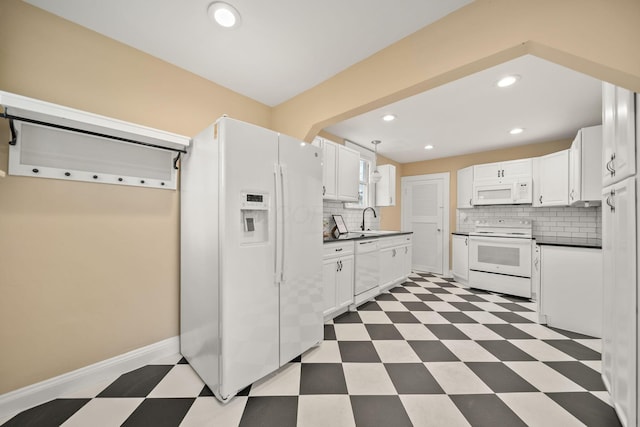 kitchen with light floors, white cabinets, backsplash, and white appliances