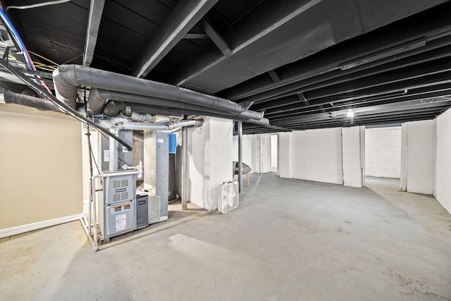 unfinished below grade area featuring heating unit