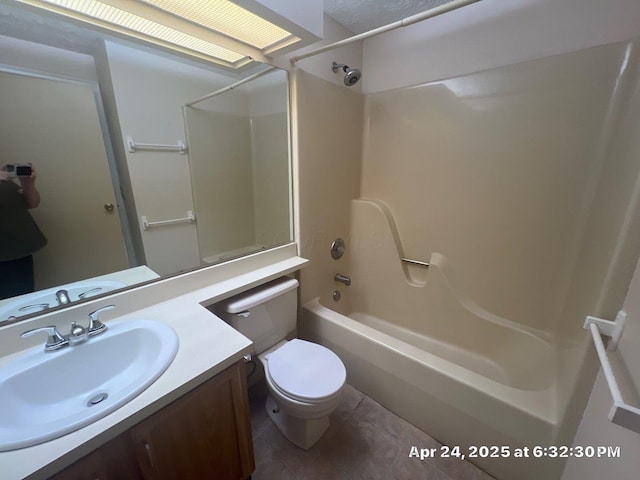 full bathroom with tile patterned flooring, toilet, vanity, and shower / washtub combination