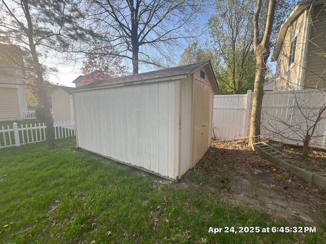 view of shed with a fenced backyard