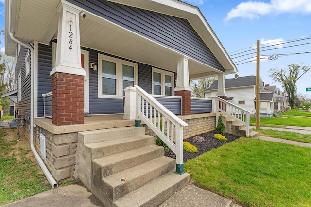 1284-1286 S Champion Ave, Columbus, OH 43206 - property entrance with a lawn and a porch