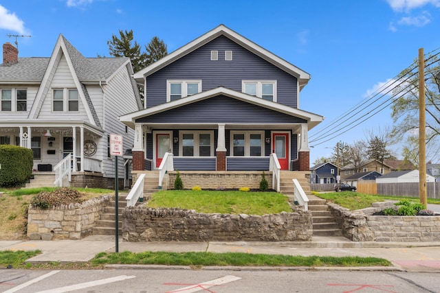 1284-1286 S Champion Ave, Columbus, OH 43206 - view of front of house featuring uncovered parking, stairs, and covered porch
