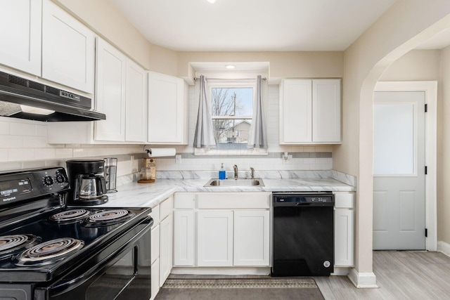 1284-1286 S Champion Ave, Columbus, OH 43206 - kitchen featuring under cabinet range hood, a sink, white cabinetry, and black appliances