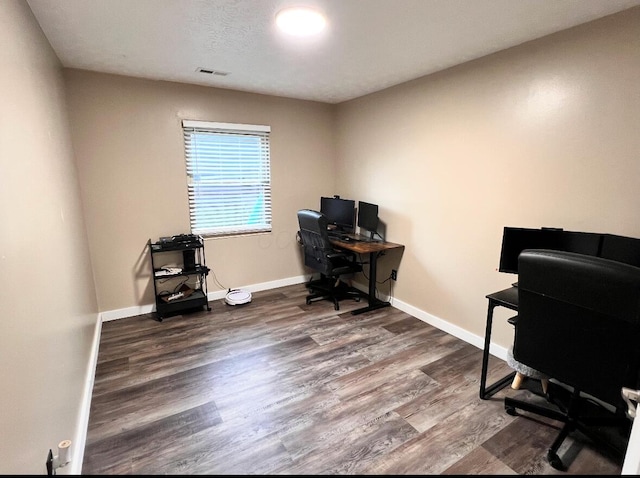 6955 Wind River Dr, Reynoldsburg, OH 43068 - home office with wood finished floors, visible vents, and baseboards