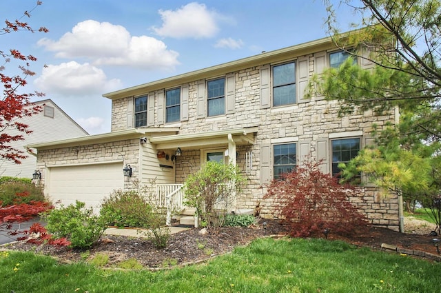 colonial home with a garage, a porch, and stone siding