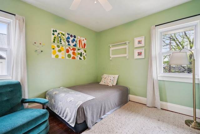 bedroom with baseboards and ceiling fan