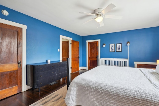 bedroom featuring wood finished floors, ceiling fan, and baseboards