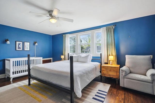 bedroom featuring wood finished floors, ceiling fan, and baseboards