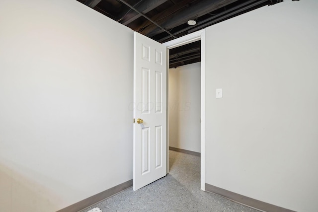 finished basement featuring baseboards