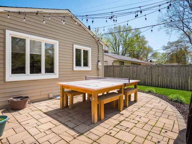view of patio featuring fence and outdoor dining space
