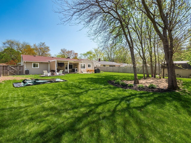 view of yard featuring a fenced backyard and a patio