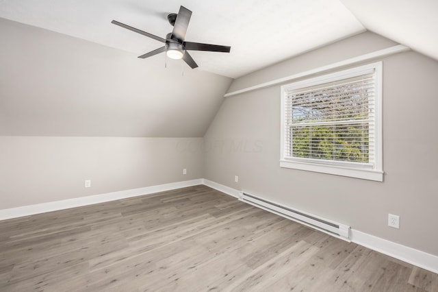 116 W S Ave, Plain City, OH 43064 - additional living space featuring lofted ceiling, wood finished floors, a ceiling fan, and a baseboard heating unit