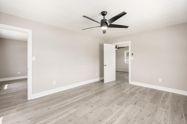 116 W S Ave, Plain City, OH 43064 - unfurnished bedroom with ceiling fan, baseboards, light wood-style flooring, and a baseboard radiator