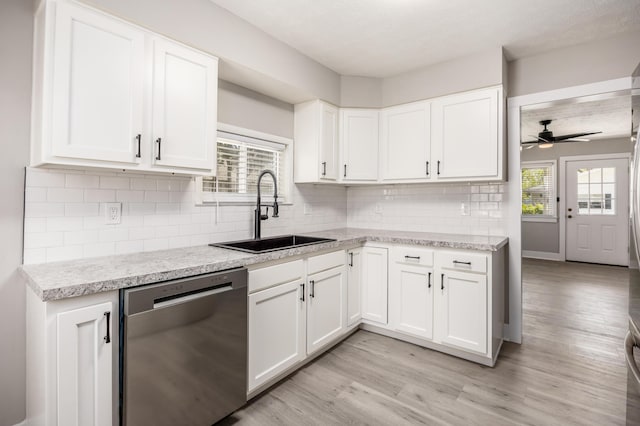 116 W S Ave, Plain City, OH 43064 - kitchen with stainless steel dishwasher, ceiling fan, a sink, white cabinetry, and light wood-type flooring