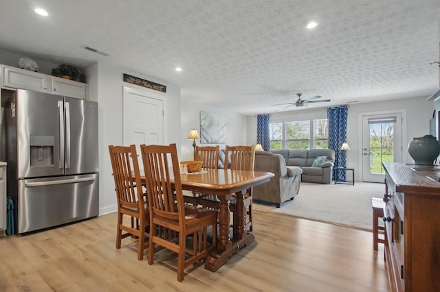 dining space featuring recessed lighting, ceiling fan, visible vents, and light wood-style floors