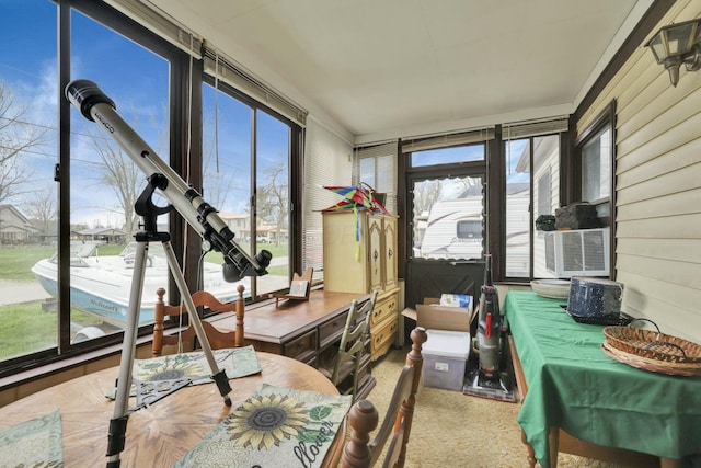 sunroom / solarium featuring cooling unit and a wealth of natural light