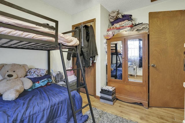 bedroom featuring wood finished floors