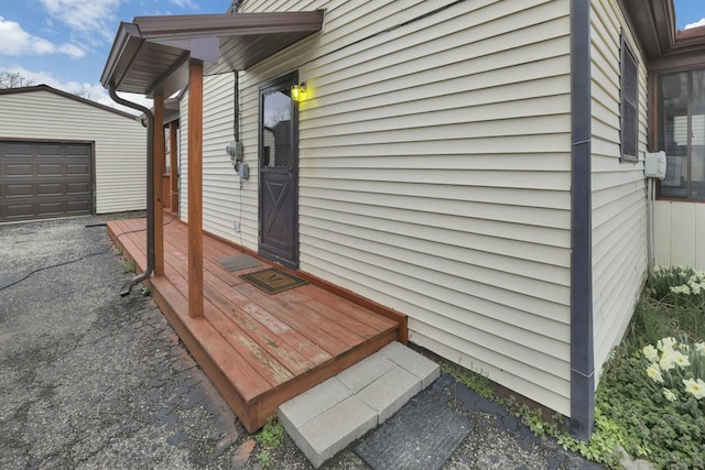 view of side of property featuring an outbuilding and a detached garage