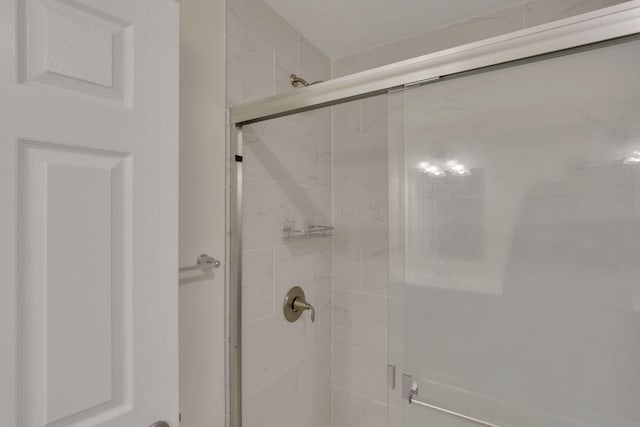 bathroom featuring a stall shower
