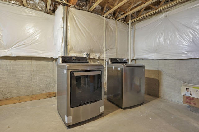 laundry area featuring laundry area and washing machine and dryer