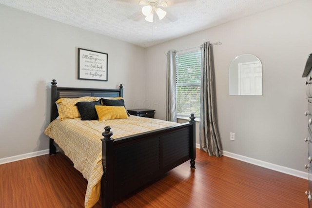 81 Highmeadows Cir, Powell, OH 43065 - bedroom with baseboards, wood finished floors, ceiling fan, and a textured ceiling