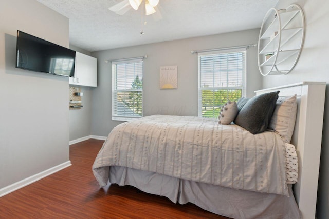 81 Highmeadows Cir, Powell, OH 43065 - bedroom with dark wood-style floors, baseboards, ceiling fan, and a textured ceiling