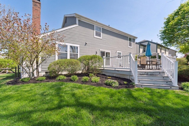 81 Highmeadows Cir, Powell, OH 43065 - back of house featuring a wooden deck, a yard, and a chimney