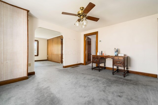 2953 Atwood Ter, Columbus, OH 43224 - interior space with baseboards, arched walkways, a ceiling fan, and carpet