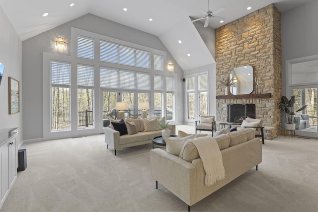 660 Woods Hollow Ln, Powell, OH 43065 - living room featuring a fireplace, light colored carpet, recessed lighting, and high vaulted ceiling