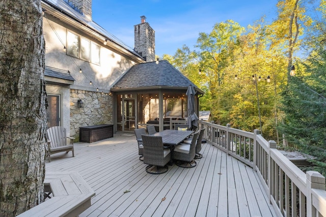 660 Woods Hollow Ln, Powell, OH 43065 - wooden deck featuring outdoor dining area