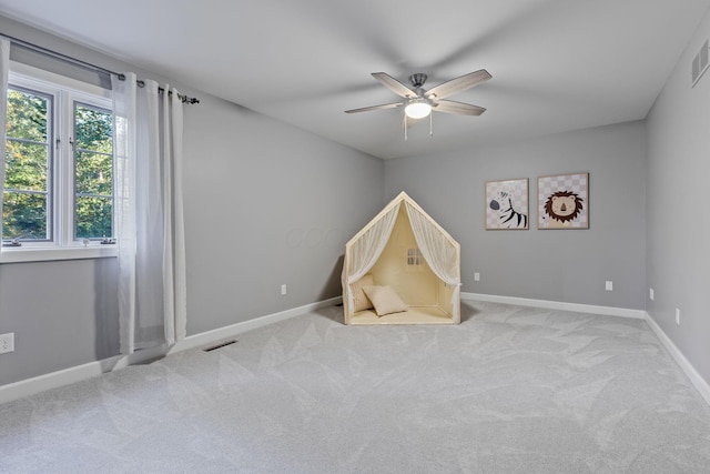 660 Woods Hollow Ln, Powell, OH 43065 - recreation room with baseboards, visible vents, ceiling fan, and carpet flooring
