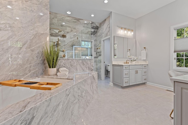 660 Woods Hollow Ln, Powell, OH 43065 - bathroom featuring recessed lighting, vanity, a bath, toilet, and a marble finish shower