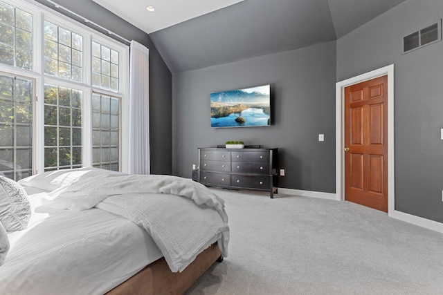 660 Woods Hollow Ln, Powell, OH 43065 - carpeted bedroom featuring visible vents, vaulted ceiling, and baseboards