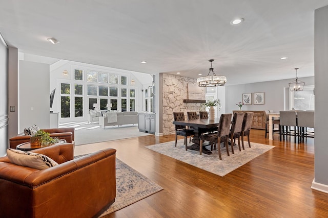 660 Woods Hollow Ln, Powell, OH 43065 - dining room with a wealth of natural light, wood finished floors, and an inviting chandelier