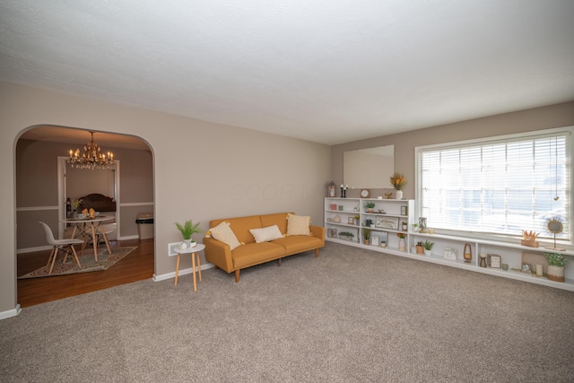 264 Merchant Ave, Marion, OH 43302 - interior space with arched walkways, baseboards, and a notable chandelier