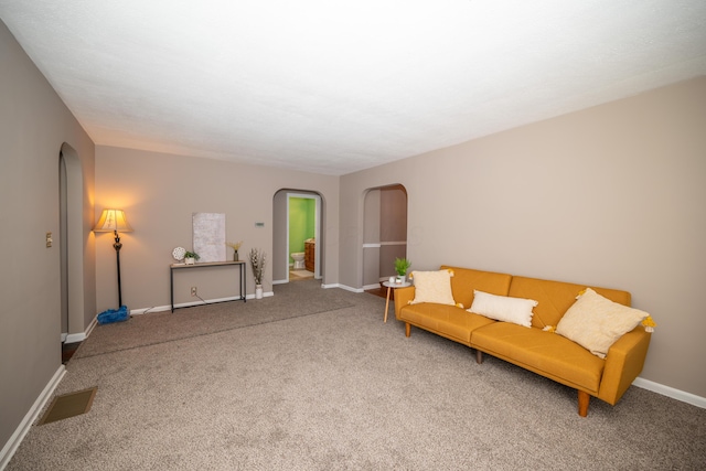 264 Merchant Ave, Marion, OH 43302 - sitting room featuring visible vents, arched walkways, and carpet