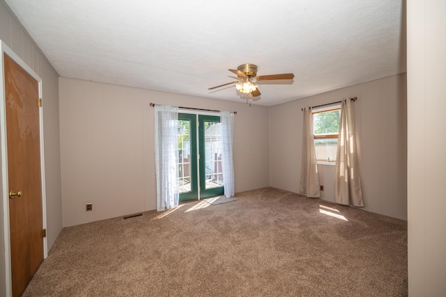 264 Merchant Ave, Marion, OH 43302 - empty room featuring ceiling fan, a wealth of natural light, and carpet