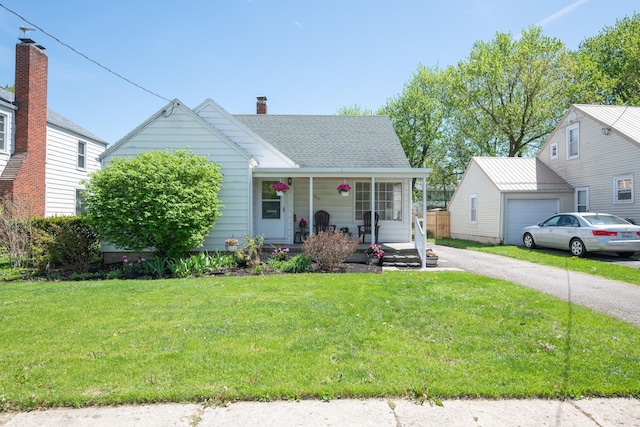 264 Merchant Ave, Marion, OH 43302 - bungalow with roof with shingles, covered porch, a chimney, and a front yard