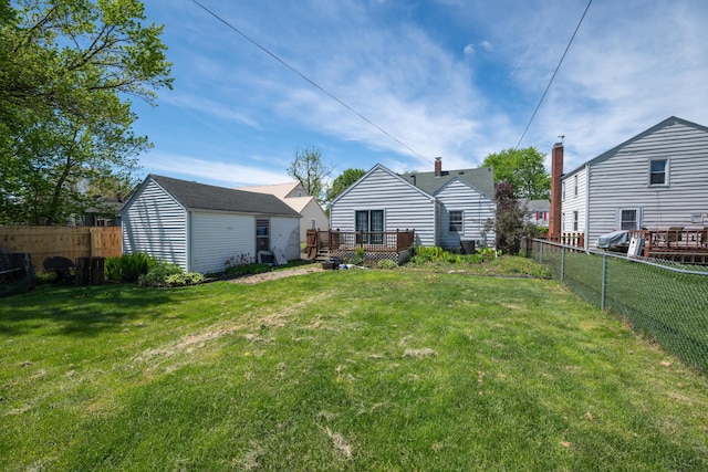 264 Merchant Ave, Marion, OH 43302 - view of yard featuring a deck, an outbuilding, and a fenced backyard