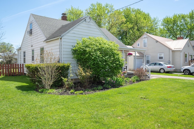 264 Merchant Ave, Marion, OH 43302 - view of property exterior with a lawn, roof with shingles, fence, and a chimney