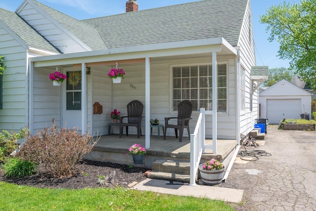 264 Merchant Ave, Marion, OH 43302 - property entrance with roof with shingles, covered porch, a chimney, and a garage