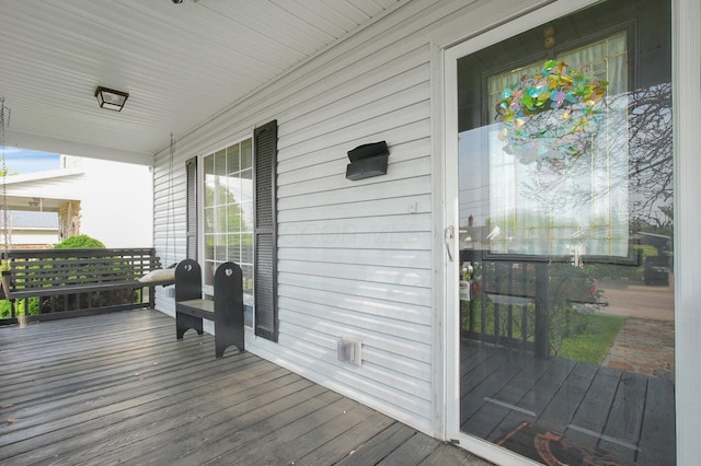 wooden deck featuring covered porch